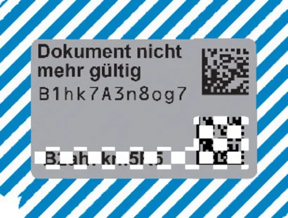 Geöffnetes Sicherheitsfeld des Fahrzeugbriefs mit zwölfstelligem Beispielcode und Ungültigkeitsvermerk